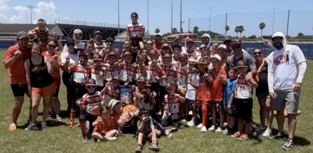West Boca All-Stars players, coaches, and families on the field